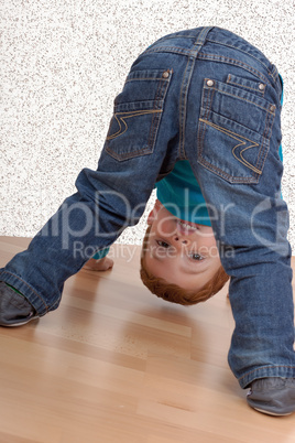 child looking through his legs