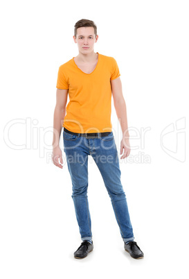 young man wearing a yellow t-shirt and slim jeans