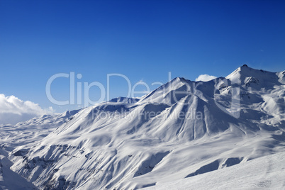 view on ski slope and beautiful mountains at sunny day