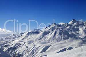 view on ski slope and beautiful mountains at sunny day