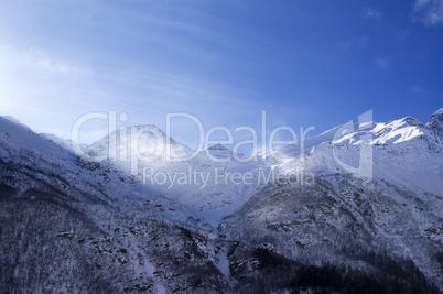 snowy sunlight mountains, view from ski slope