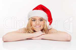 young woman in santa claus hat posing isolated on white