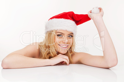 young woman in santa claus hat posing isolated on white