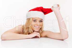 young woman in santa claus hat posing isolated on white
