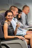 young businesswoman enjoy flight glass champagne