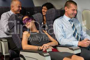business woman sleep during flight airplane cabin