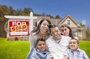 hispanic family, new home and sold real estate sign