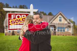 mixed race couple, house, sold real estate sign