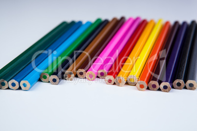 a stack of colored pencils