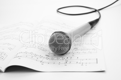 microphone lying on the musical book