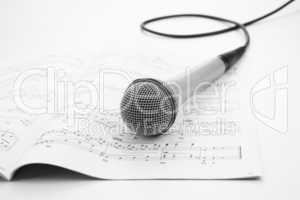 microphone lying on the musical book