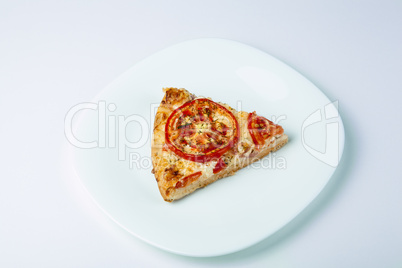 a slice of pizza on a white plate