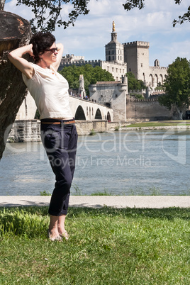 woman against the backdrop of avignon