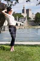 woman against the backdrop of avignon