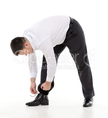 man bending down to do up his shoelaces