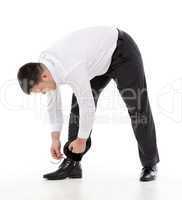 man bending down to do up his shoelaces