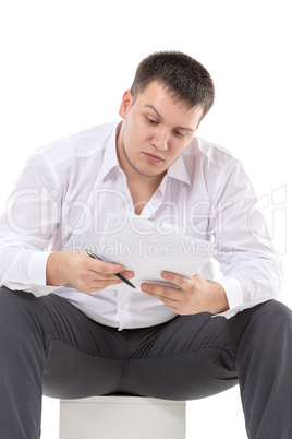 businessman reading a report with scepticism