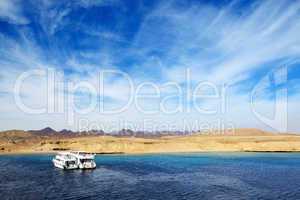 motor yachts and snorkeling tourists in ras muhammad national pa