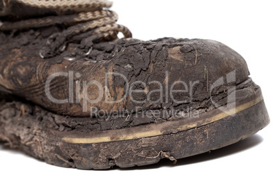 old dirty hiking boot isolated on white background