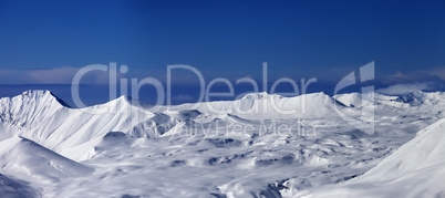 panoramic view on snowy plateau and blue sky at nice day