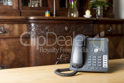 phone on wooden table in living room