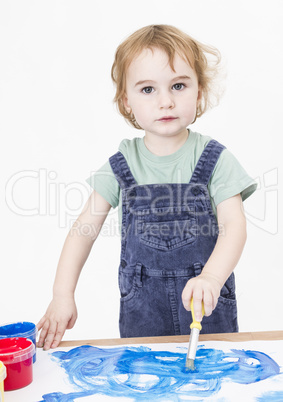 cute girl painting on small desk