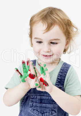 cute little girl with finger paint