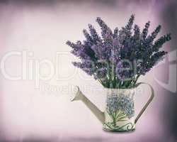 Watering can with plucket lavender