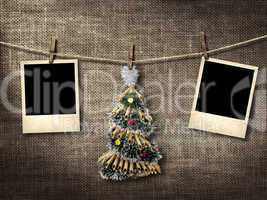 old style photographs and christmas tree hanging on a clotheslin