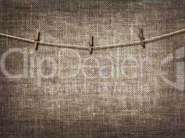 clothesline with clothespins on linen background