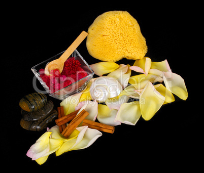 Accessories for spa with salt bath, cinnamon, stones and petals