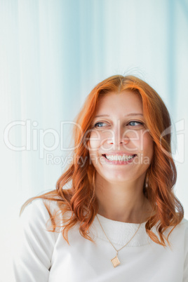 portrait of smiling red-haired woman