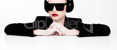 sexy woman in sunglasses listening to music