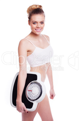 woman with scales. heathy weight concept.