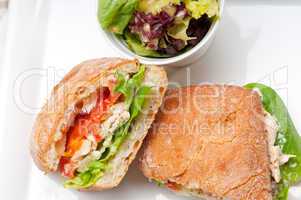 ciabatta panini sandwich with chicken and tomato