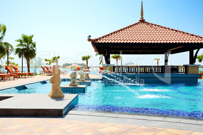 the swimming pool near beach in thai style hotel on palm jumeira