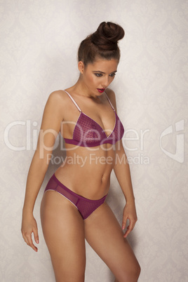 beautiful tanned elegant woman in purple lingerie