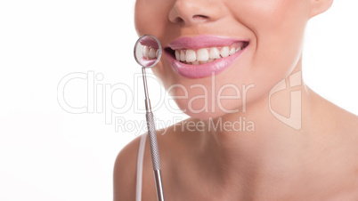 smiling woman showing off her healthy white teeth
