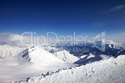 snowy mountains and off-piste slope at nice day