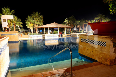 swimming pool in night illumination at the luxury hotel, sharm e