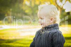 Adorable Blonde Baby Boy Outdoors at the Park.