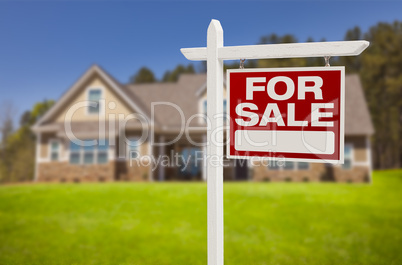 home for sale sign in front of new house