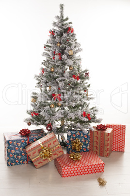 gift boxes wrapped under the christmas tree