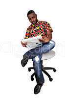 black man reading paper.
