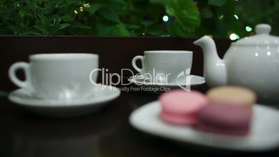 tea with macaroons in cafe.