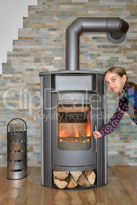 child opening wood fired stove