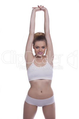 fit woman doing stretching exercises, on white