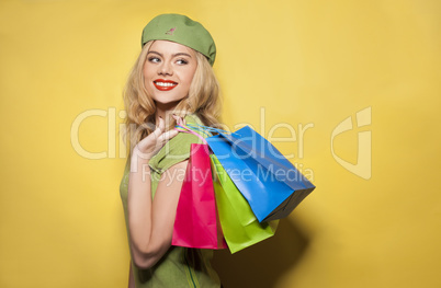 fashionable woman holding shopping paper bags
