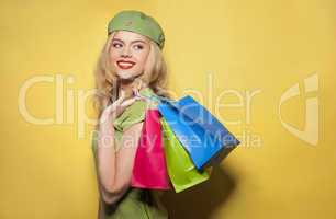 fashionable woman holding shopping paper bags