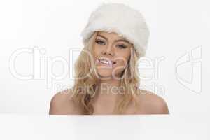 beautiful smiling blond woman in a fur hat